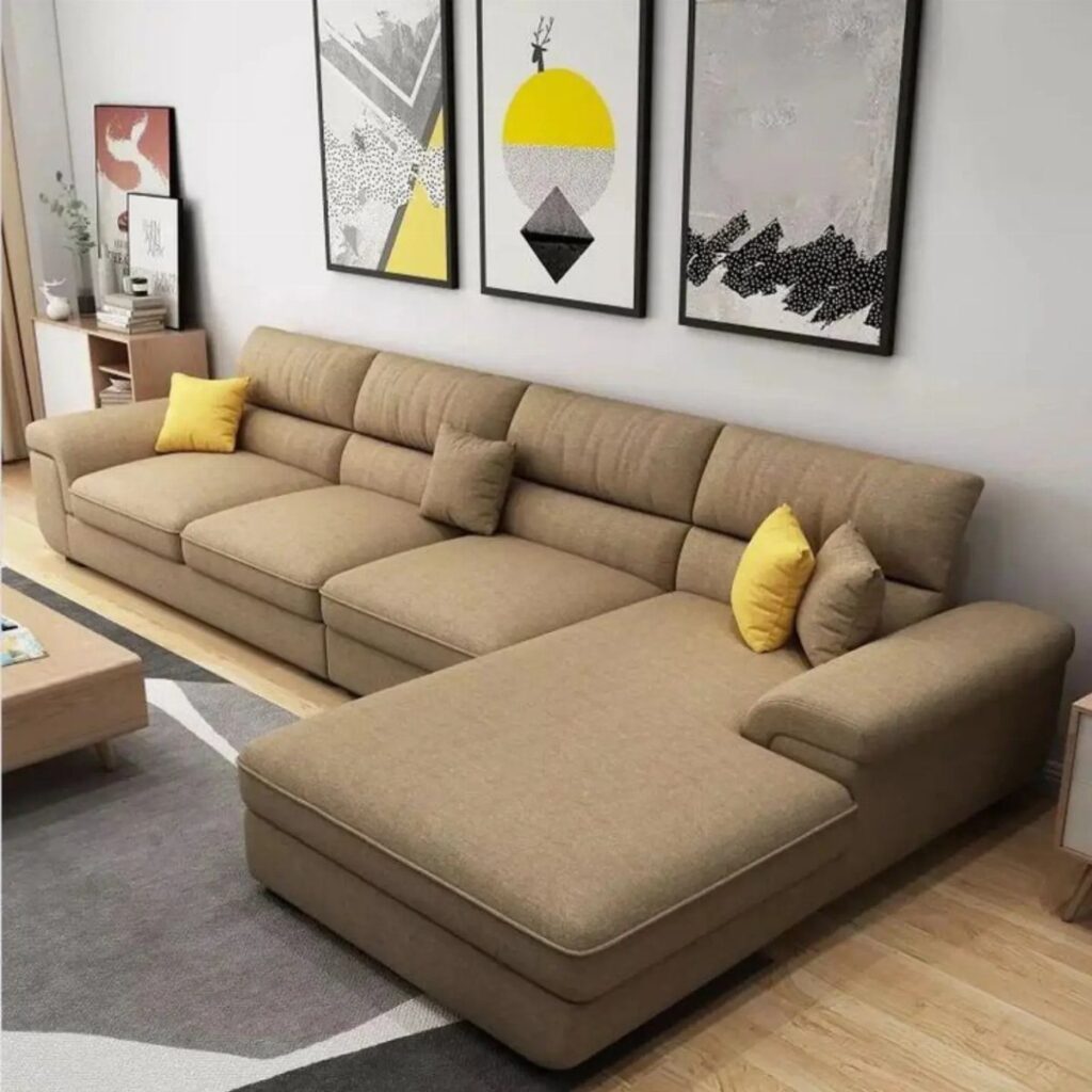 Brown sectional sofa with bright yellow and brown throw pillows in modern room
